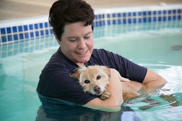 Laurie Duperier in the pool with a dog