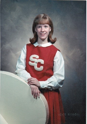 I was a cheerleader in high school. Mom made our uniforms.